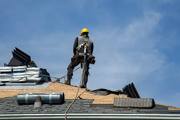 Professional Roofing technician working in Howard, PA